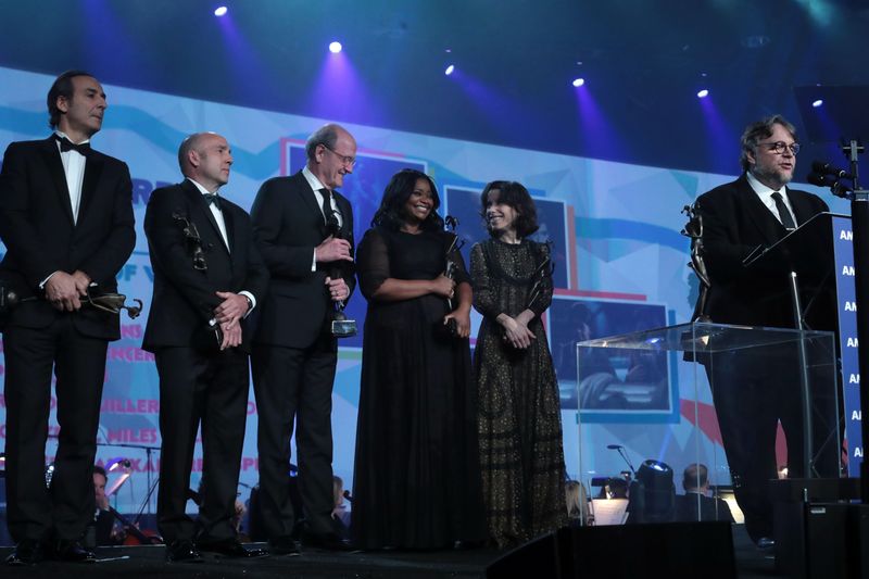 Director Guillermo del Toro, right, and the cast of "The Shape of Water" are presented the Vanguard Award at the 29th Annual Palm Springs International Film Festival Gala on Tuesday, Jan. 2, 2018 in Palm Springs, CA