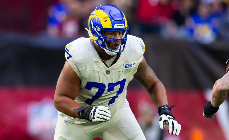 Nov 26, 2023; Glendale, Arizona, USA; Los Angeles Rams offensive tackle Alaric Jackson (77) against the Arizona Cardinals at State Farm Stadium. Mandatory Credit: Mark J. Rebilas-USA TODAY Sports