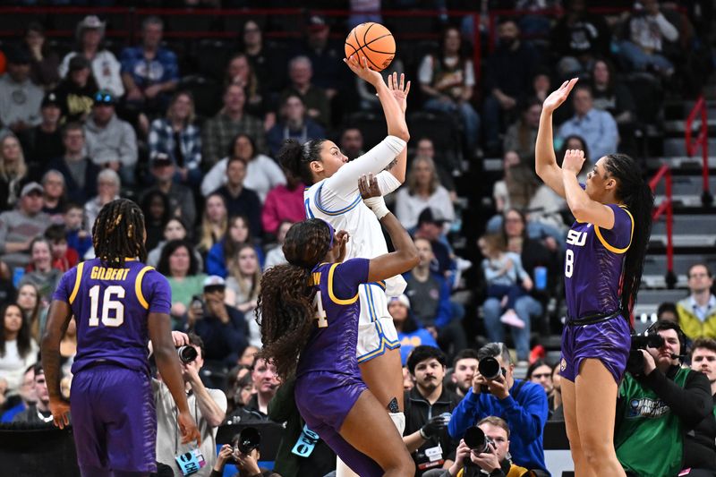 Mar 30, 2025; Spokane, WA, USA; UCLA Bruins forward Timea Gardiner (30) shoots against LSU Lady Tigers forward Jersey Wolfenbarger (8) during the first half of a Elite 8 NCAA Tournament basketball game at Spokane Arena. Mandatory Credit: James Snook-Imagn Images