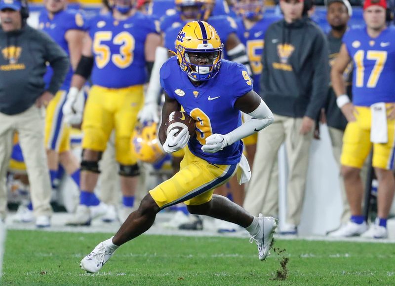 Nov 4, 2023; Pittsburgh, Pennsylvania, USA; Pittsburgh Panthers wide receiver Konata Mumpfield (9) runs after a catch against the Florida State Seminoles during the fourth quarter at Acrisure Stadium. The Seminoles won 24-7. Mandatory Credit: Charles LeClaire-USA TODAY Sports