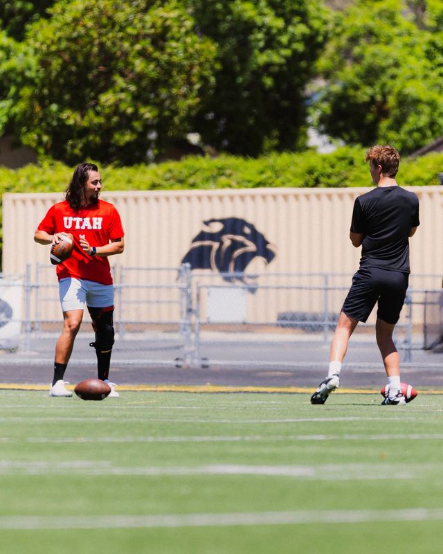 Cameron Rising, left, and Newbury Park High quarterback Brady Smigiel, shown working out at Panther Stadium.