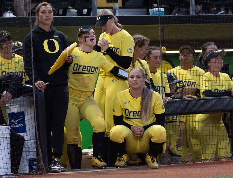 The Oregon dugout looks for a comeback against Michigan in the seventh inning at Jane Sanders Stadium.