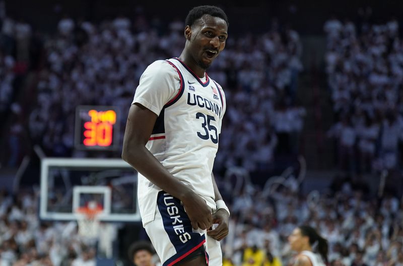 Mar 5, 2025; Storrs, Connecticut, USA; UConn Huskies center Samson Johnson (35) reacts after his basket against the Marquette Golden Eagles in the second half at Harry A. Gampel Pavilion. Mandatory Credit: David Butler II-Imagn Images