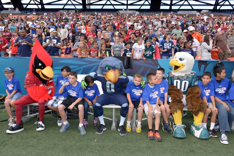 January 25, 2014; Honolulu, HI, USA; Arizona Cardinals mascot Big Red (left) Seattle Seahawks mascot Blitz (center) and Philadelphia Eagles mascot Swoop visit with NFL Play 60 participants during the 2014 Pro Bowl Ohana Day at Aloha Stadium. Mandatory Credit: Kirby Lee-USA TODAY Sports