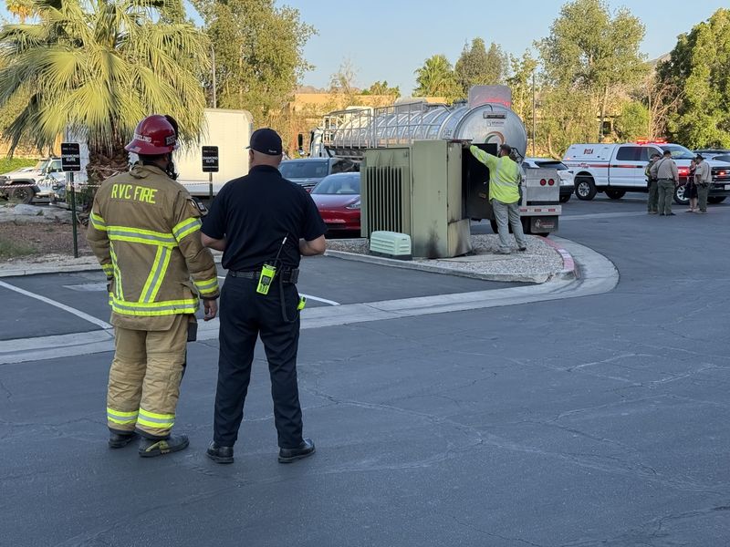 Responders at the scene where a semi truck hit a generator in Palm Desert on Saturday.