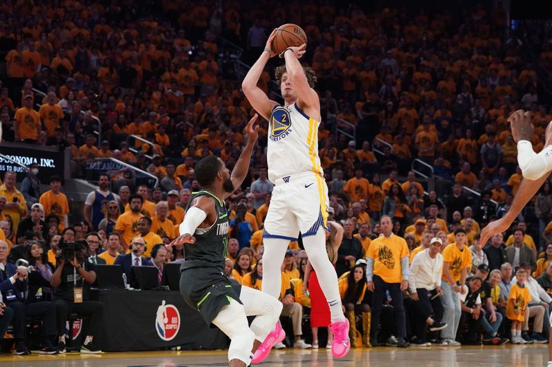 May 10, 2025; San Francisco, California, USA; Golden State Warriors guard Brandin Podziemski (2) shoots over Minnesota Timberwolves guard Mike Conley (10) in the second quarter during game three in the second round of the 2025 NBA Playoffs at Chase Center. Mandatory Credit: David Gonzales-Imagn Images
