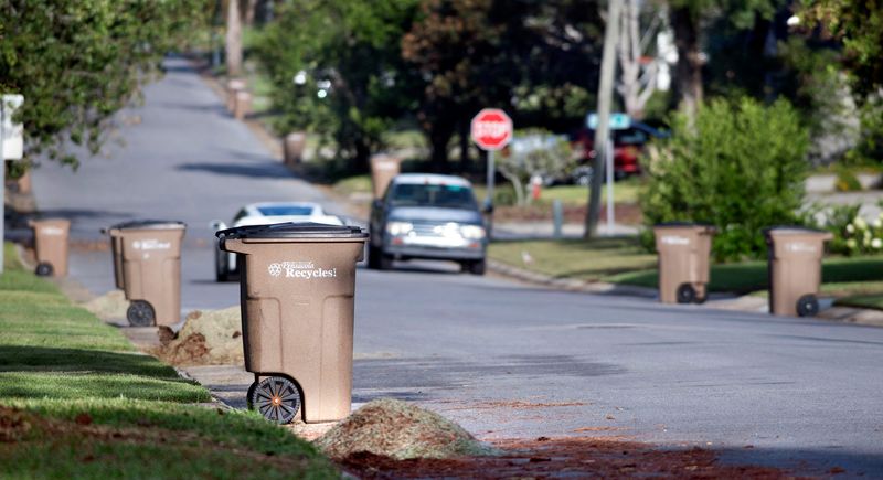 Empty recycling cans wait at curbside in the Cordova Park area for pickup on Tuesday, Oct. 3, 2023. Pensacola announced this week it is ready to resume residential curbside recycling through a new partnership with The Recycling Partnership.