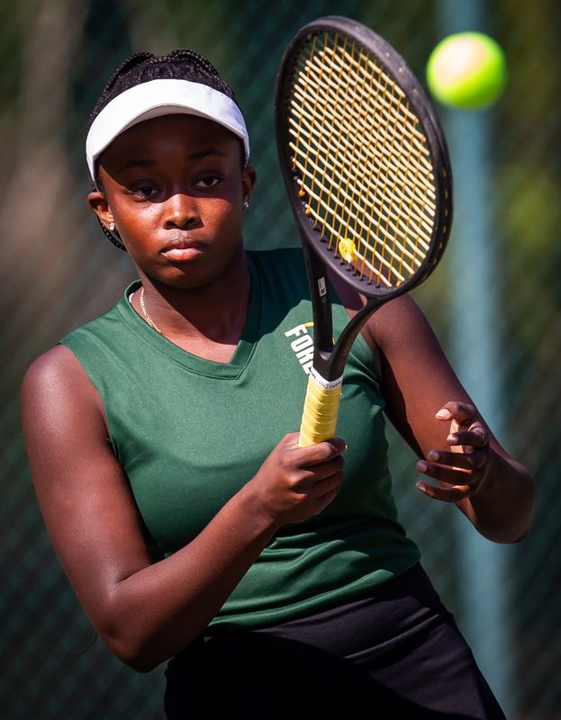 Forest’s Madison Moloch returns a volley in the #1 seed singles match against Vanguard’s Katelyn Gabel during the MCIAC Tennis Tournament held Thursday March 21, 2024. The boys tournament was held at Tuscawilla Park while the girls tournament was held at Coehadjoe Park. [Doug Engle/Ocala Star Banner]2024