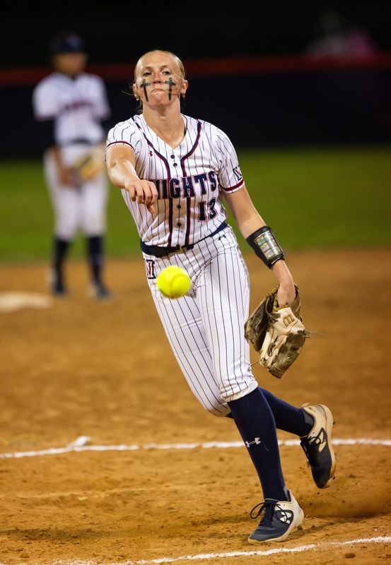 Vanguard Knights Hannah Davis (13) pitches in the first inning. The Vanguard Knights played the Belleview Rattlers in the MCIAC Softball Tournament championship game at Vanguard High School in Ocala, FL on Friday, April 12, 2024. [Doug Engle/Ocala Star Banner]