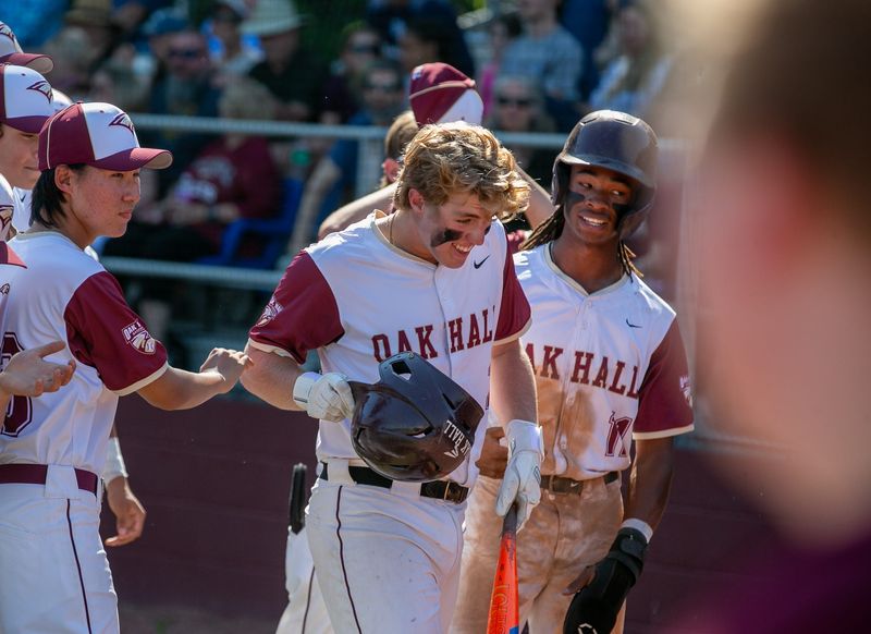 Oak Hall Gavin Jones (2), center, celebrates a home run with the team during an FHSAA baseball game at Oak Hill School in Gainesville, FL on Friday, April 19, 2024. [Alan Youngblood/Gainesville Sun]