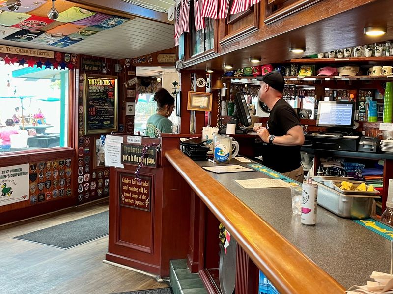 Grab a drink at the bar and head to a beach-side table or chair at The Mucky Duck.