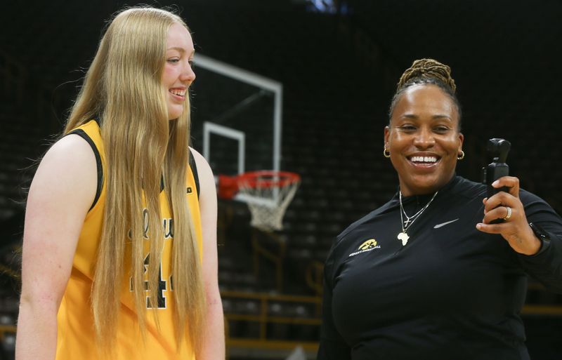 Iowa women’s basketball senior forward Addison O’Grady and assistant coach Raina Harmon chat during media day Thursday, Oct. 10, 2024 at Carver-Hawkeye Arena Iowa City, Iowa.