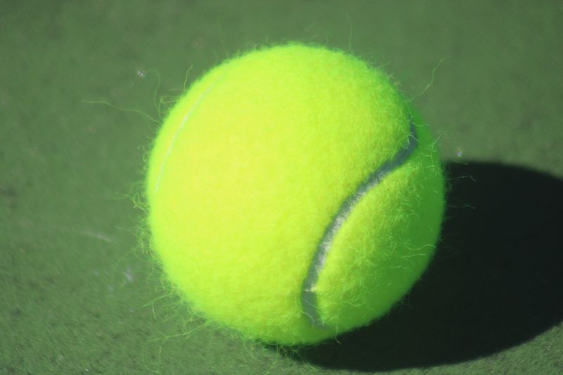 STOCK | A tennis ball is pictured on the court during the Gateway Conference high school girls tennis championship between Stanton and Fletcher in Jacksonville, Florida, on May 4, 2024. [Clayton Freeman/Florida Times-Union]