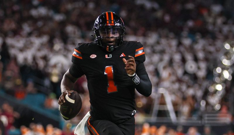 Oct 26, 2024; Miami Gardens, Florida, USA; Miami Hurricanes quarterback Cam Ward (1) runs with the football against the Florida State Seminoles during the second quarter at Hard Rock Stadium. Mandatory Credit: Sam Navarro-Imagn Images ORG XMIT: IMAGN-883316 ORIG FILE ID: 20241026_SN_0059_na2_.jpg