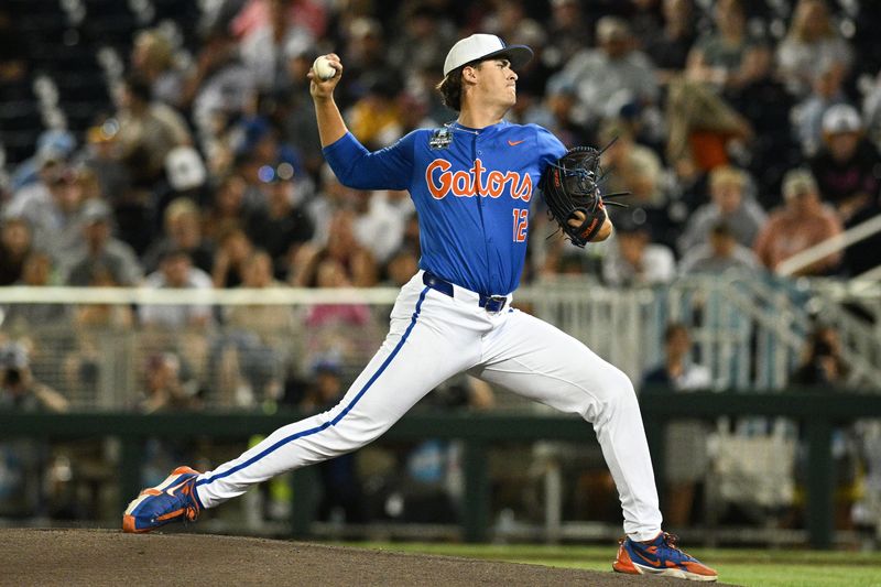 Jun 15, 2024; Omaha, NE, USA; Florida Gators starting pitcher Liam Peterson (12) throws against the Texas A&M Aggies during the first inning at Charles Schwab Field Omaha. Mandatory Credit: Steven Branscombe-USA TODAY Sports