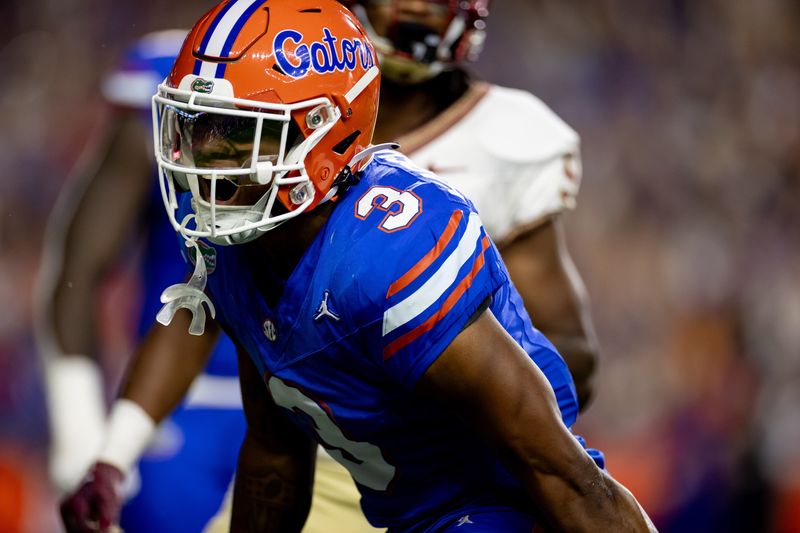 Florida Gators cornerback Jason Marshall Jr. (3) celebrates after a stop during the first half against the Florida State Seminoles at Steve Spurrier Field at Ben Hill Griffin Stadium in Gainesville, FL on Saturday, November 25, 2023. [Matt Pendleton/Gainesville Sun]