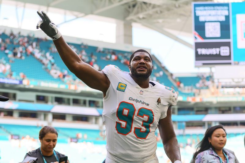 Sep 8, 2024; Miami Gardens, Florida, USA;Miami Dolphins defensive tackle Calais Campbell (93) celebrates after the game against the Jacksonville Jaguars at Hard Rock Stadium. Mandatory Credit: Sam Navarro-Imagn Images