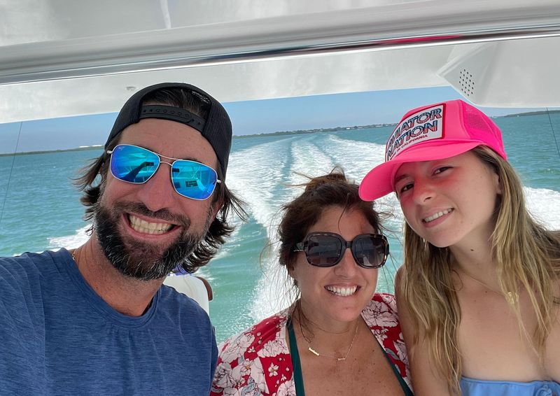 Andy, Melissa and Lucy Fernandez pose for a selfie on their boat Bimini in May 2022.