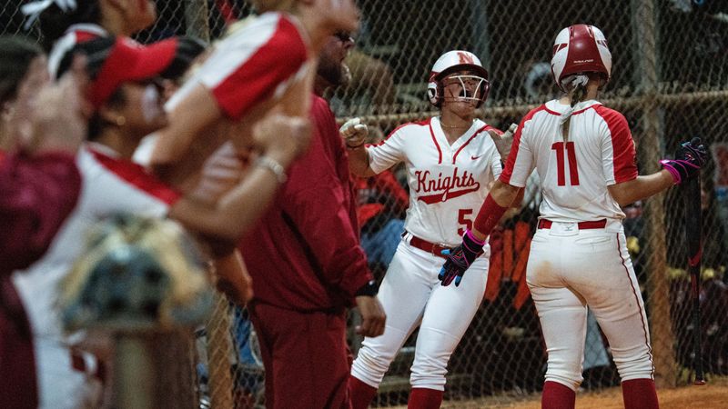 Abby Hynes #5 of the North Fort Myers High School softball team scores against Evangelical Christian School at North Fort Myers on Tuesday, March 11, 2025. ECS won in extra innings.