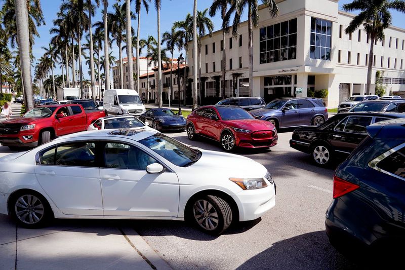 Road closures of South Ocean Boulevard near Mar-a-Lago in Palm Beach and South Flagler Drive for the Palm Beach International Boat Show in West Palm Beach add to the gridlock of west bound traffic on Royal Palm Way just after 3 p.m. Friday March 14, 2025 in Palm Beach.