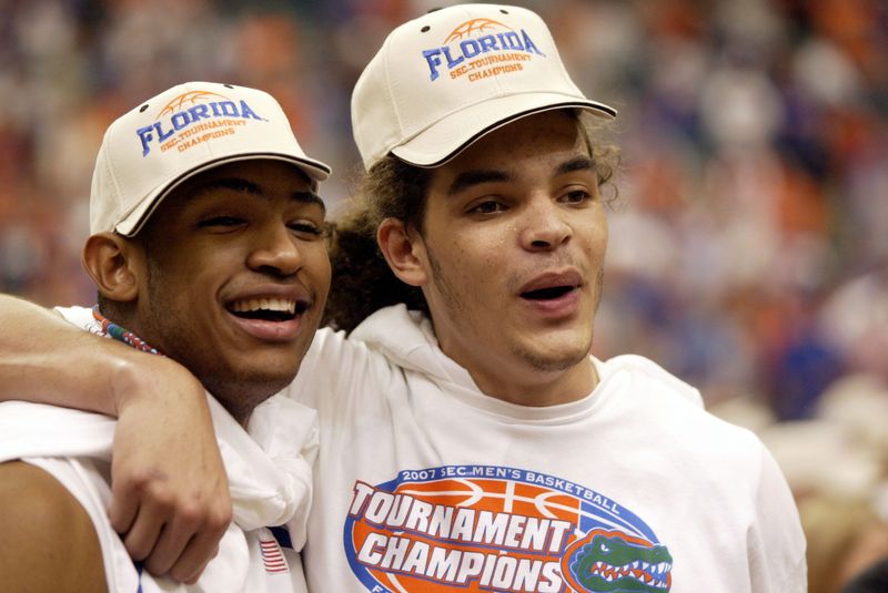 Mar 11, 2007; Atlanta, GA, USA; Florida Gators forward Joakim Noah (right) celebrates with forward Al Horford after the Gators defeated the Arkansas Razorbacks 77-56 to win the SEC Tournament championship game at the Georgia Dome in Atlanta, GA. Mandatory Credit: Jason Parkhurst-USA TODAY Sports Copyright © 2007 Jason Parkhurst