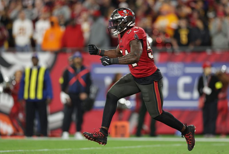 Jan 12, 2025; Tampa, Florida, USA; Tampa Bay Buccaneers linebacker Lavonte David (54) celebrates after a stop during the fourth quarter of a NFC wild card playoff against the Washington Commanders at Raymond James Stadium. Mandatory Credit: Nathan Ray Seebeck-Imagn Images