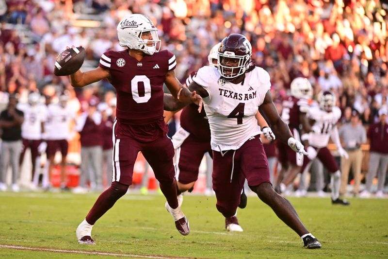 Oct 19, 2024; Starkville, Mississippi, USA;Mississippi State Bulldogs quarterback Michael Van Buren Jr. (0) drops back to pass against Texas A&M Aggies defensive lineman Shemar Stewart (4) during the third quarter at Davis Wade Stadium at Scott Field. Mandatory Credit: Matt Bush-Imagn Images