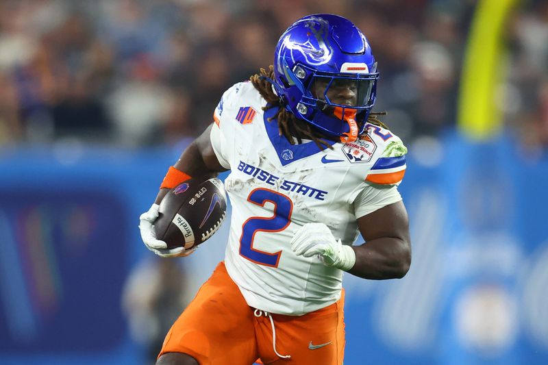 Boise State Broncos running back Ashton Jeanty (2) rushes the ball against the Penn State Nittany Lions during the first half in the Fiesta Bowl at State Farm Stadium.