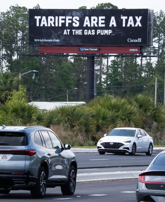 The Canadian government paid for billboard ads in 12 states including Florida and some of those ads are on billboards next to heavily traveled roads in Jacksonville. One billboard along Rossevelt Blvd and I-295 near NAS Jax, displays a message that taxes at the gas pump are tariffs as traffic makes its way along the road Monday March 31, 2025. [Doug Engle/Florida Times-Union]