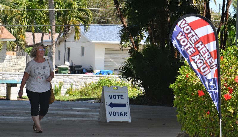 A voter leaves the Scotty Culp Community Center in Satellite Beach. Republicans went to the polls Tuesday in GOP primaries to decide who their party candidates will be in special election to fill vacancies in the Florida Senate and House,