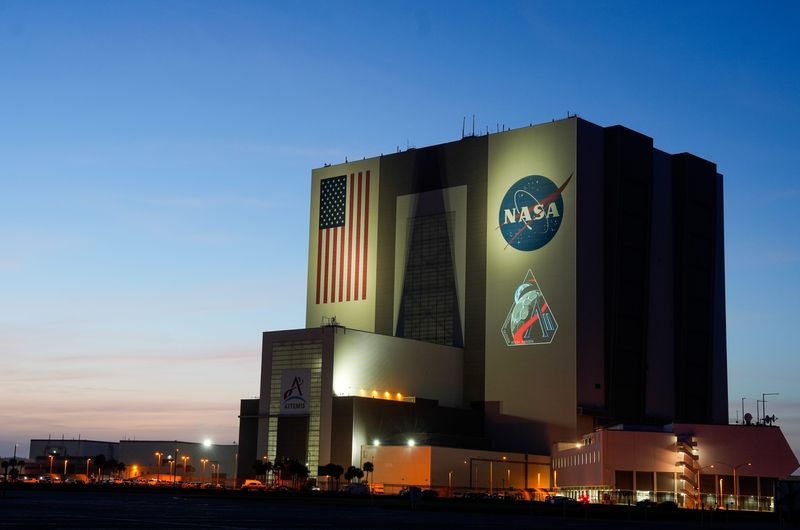 The insignia for the Artemis II mission is projected onto the Vehicle Assembly Building at Kennedy Space Center, FL Thursday, April 3, 2025. The mission logo was unveiled in advance of the launch, which will take four astronauts around the moon. Craig Bailey/FLORIDA TODAY via USA TODAY NETWORK