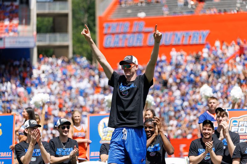 Apr 12, 2025; Gainesville, FL, USA; Florida Gators forward Alex Condon (21) gestures during the National Championship celebration at Ben Hill Griffin Stadium. Mandatory Credit: Matt Pendleton-Imagn Images