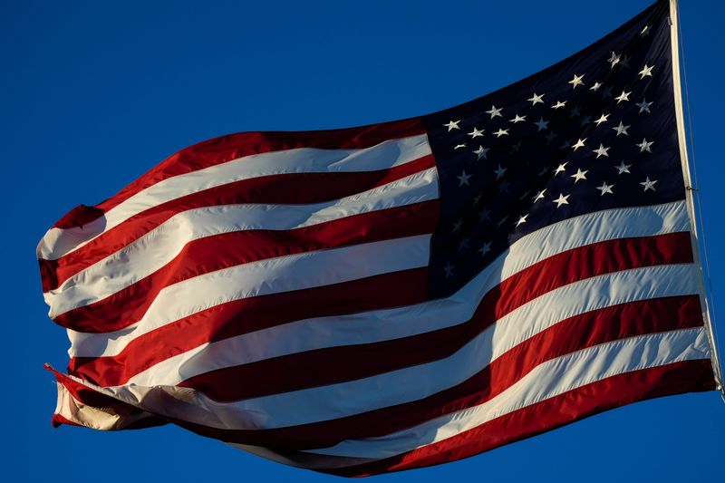 The sun rises on Veterans Memorial Island Sanctuary as the flag flies at half-staff for the late President Jimmy Carter, Thursday, Jan. 9, 2025, in Vero Beach.