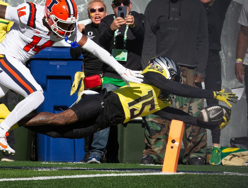Oregonâ€™s Tez Johnson dives into the end zone for the first score of the game against Illinois at Autzen Stadium.