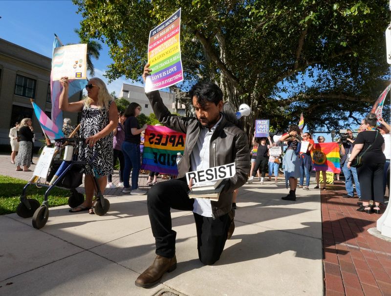 Naples Pride supporters gathered in front of the old Lee County Courthouse building in downtown Fort Myers Friday, May 2, 2025 to protest ahead of a court hearing after they filed a federal lawsuit against the city of Naples. The lawsuit was filed after officials denied a permit for its outdoor drag show. Counter protesters were also present and both groups clashed during the protest.