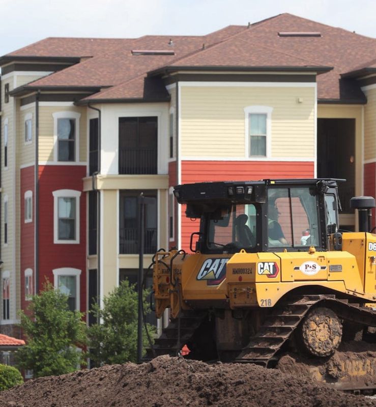 A P&S Paving bulldozer clears land on a commercial site on LPGA Boulevard in Daytona Beach in May 2021 in front of the Sands Parc apartments on Williamson Boulevard. Daytona Beach-based P&S on April 30, 2025 was named by the Florida Department of Transportation as the low-bidder to become the general contractor to build its planned $120 million Interstate 95 at Pioneer Trail interchange project in Port Orange/New Smyrna Beach.