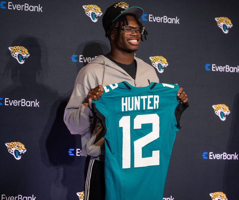 Apr 25, 2025; Jacksonville, FL, USA; Jacksonville Jaguars first round draft pick Travis Hunter poses for a photo during a press conference at Miller Electric Center.