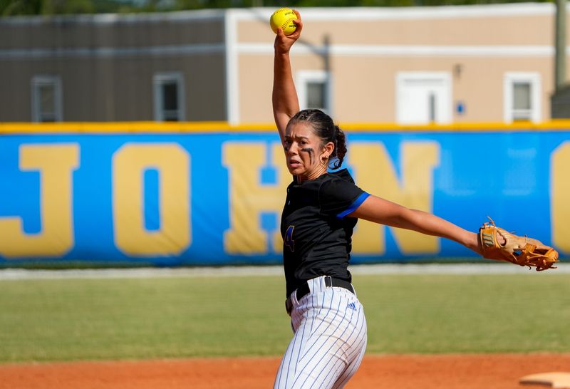 John Carroll’s Makayla Ortiz (4) pitches against Carrollton School of the Sacred Heart, May 7, 2025, during a softball Region 4-2A Quarterfinal game. John Carroll Catholic High School won 13-2.