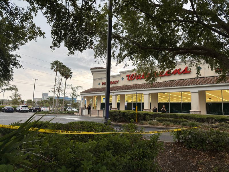 Port Orange police and other local law enforcement agencies investigate a shooting at the Walgreens on Taylor Road, Wednesday, May 7, 2025.