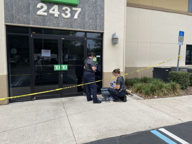 Ocala Police evidence technicians are shown at the TD Bank branch at Southeast 25th Terrace and 17th Street on Thursday, May 8, 2025. The branch was robbed earlier in the afternoon.