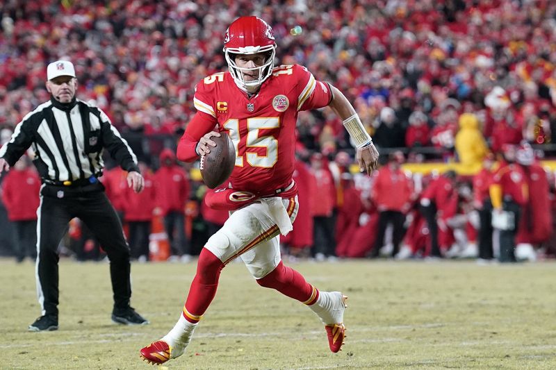 Jan 26, 2025; Kansas City, MO, USA; Kansas City Chiefs quarterback Patrick Mahomes (15) rushes the ball against the Buffalo Bills during the first half in the AFC Championship game at GEHA Field at Arrowhead Stadium. Mandatory Credit: Denny Medley-Imagn Images
