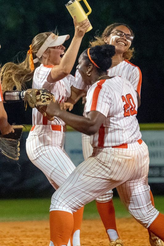 Lake Wales pitcher Anna Conroy, left, Keira Davis and Zamirya McBurrows celebrate their victory over Lake Region in the Class 4A, Region 2 semifinals.