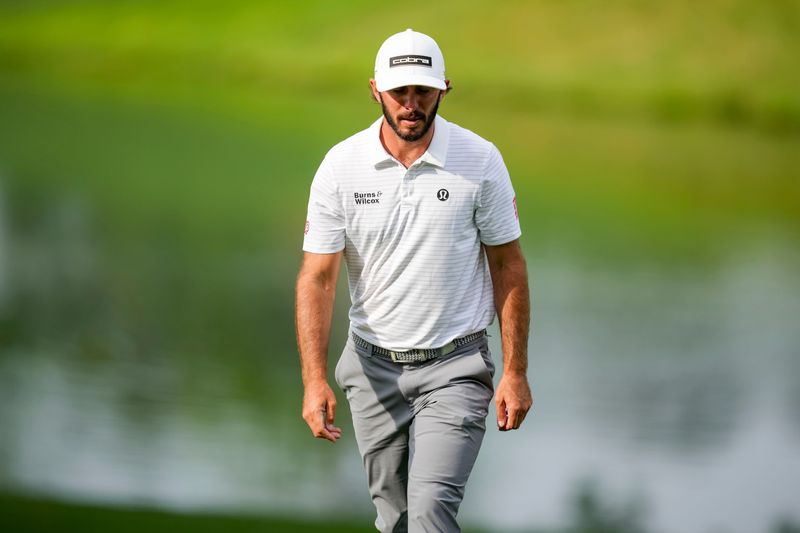 May 16, 2025; Charlotte, North Carolina, USA; Max Homa walks up to the fifteenth hole fairway during the second round of the PGA Championship golf tournament at Quail Hollow. Mandatory Credit: Aaron Doster-Imagn Images