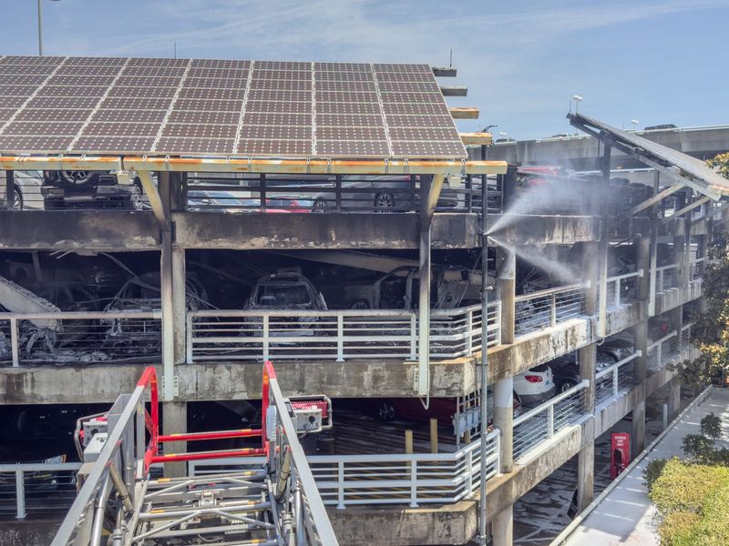 Dozens of cars were damaged May 16 when a fire swept through the third floor of the hourly parking garage at Jacksonville International Airport.