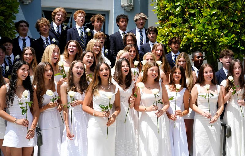 Students pose for a class photo before the Palm Beach Day Academy Eighth Grade Commencement Ceremony for the class of 2025 May 30, 2025 at the Seaview Campus in Palm Beach.