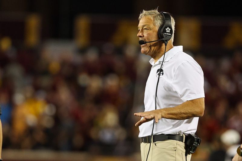 Sep 21, 2024; Minneapolis, Minnesota, USA; Iowa Hawkeyes head coach Kirk Ferentz looks on during the first half against the Minnesota Golden Gophers at Huntington Bank Stadium. Mandatory Credit: Matt Krohn-Imagn Images