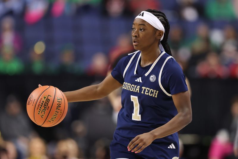 Mar 7, 2025; Greensboro, NC, USA; Georgia Tech Yellow Jackets guard Chazadi Wright (1) dribbles the ball during the first quarter against NC State Wolfpack at First Horizon Coliseum. Mandatory Credit: Cory Knowlton-Imagn Images