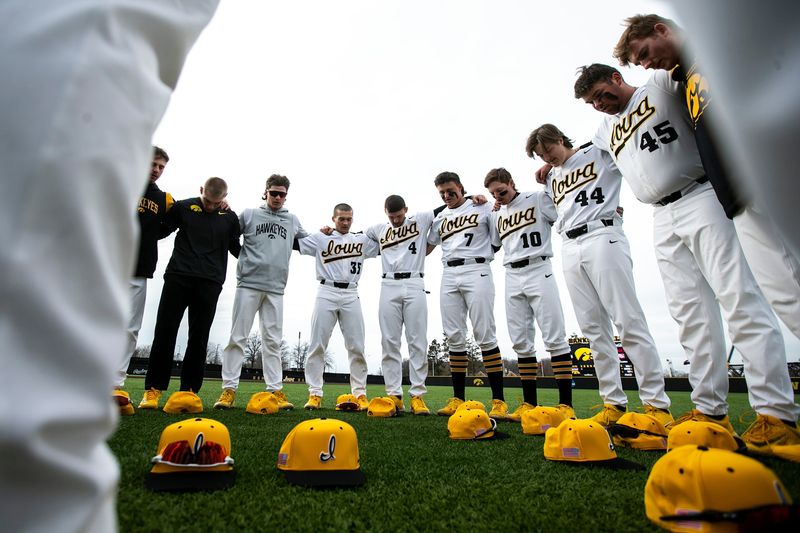 Iowa Hawkeyes players huddle up while doing a prayer before a NCAA baseball game against Loras College, Tuesday, Feb. 28, 2023, at Duane Banks Field in Iowa City, Iowa.

230228 Loras Iowa Bsb 001 Jpg