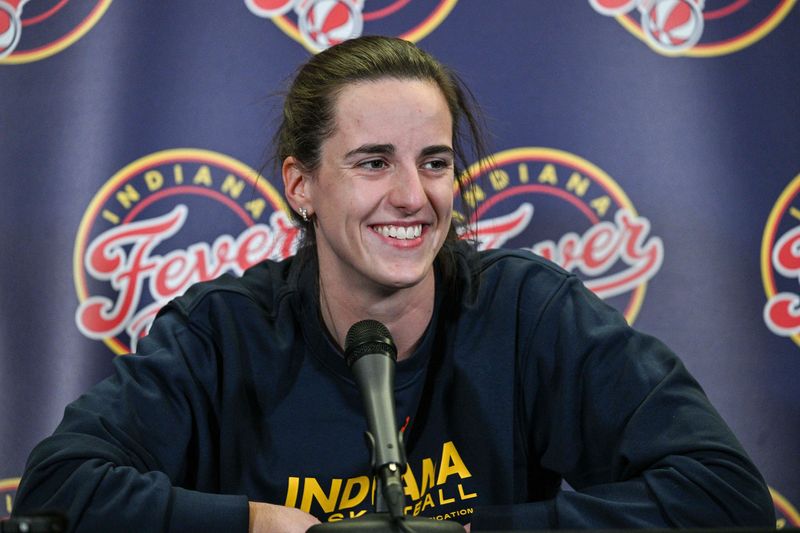 May 4, 2025; Iowa City, IA, USA; Indiana Fever guard Caitlin Clark (22) answers questions before the preseason game against the Brazil National Team at Carver-Haweye Arena. Mandatory Credit: Jeffrey Becker-Imagn Images