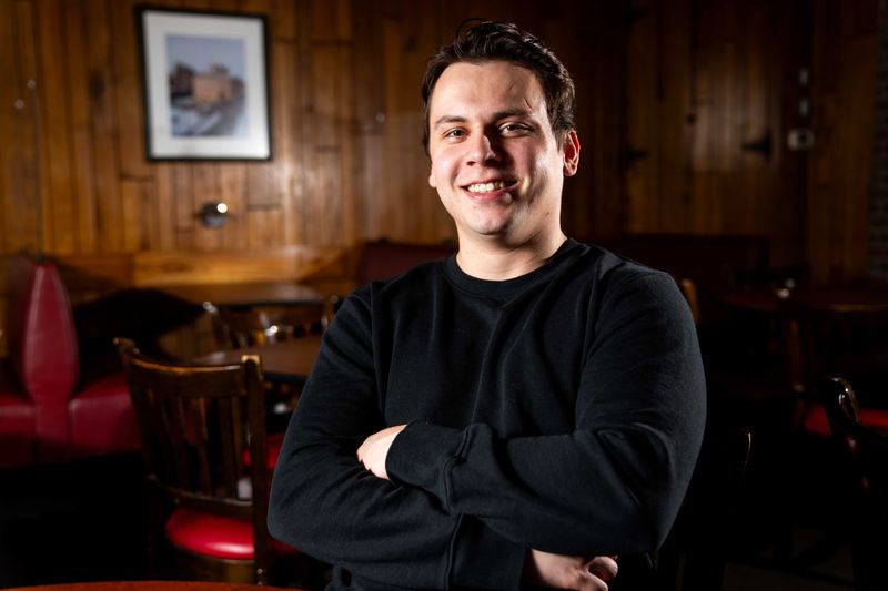 Carter Annett, the new owner of Jesse's Embers, sits for a portrait on May 7, 2025, in Des Moines.